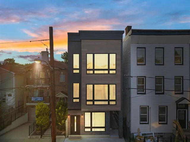 a view of a building from a ceiling fan