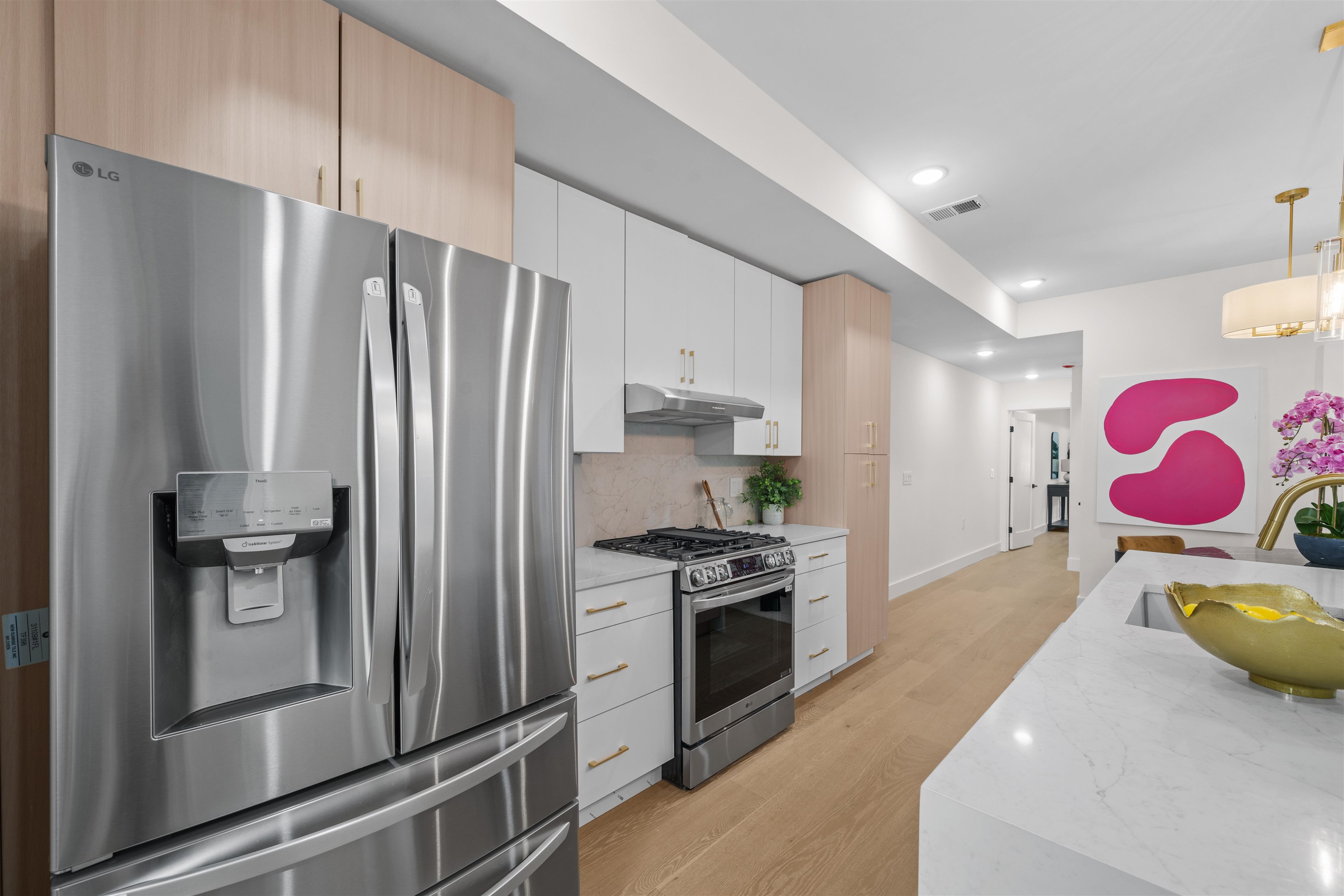 249.5 Halladay Street, Unit 1 Jersey City, NJ 07304 - Photo 5 of 31 a kitchen with stainless steel appliances granite countertop a refrigerator sink and stove
