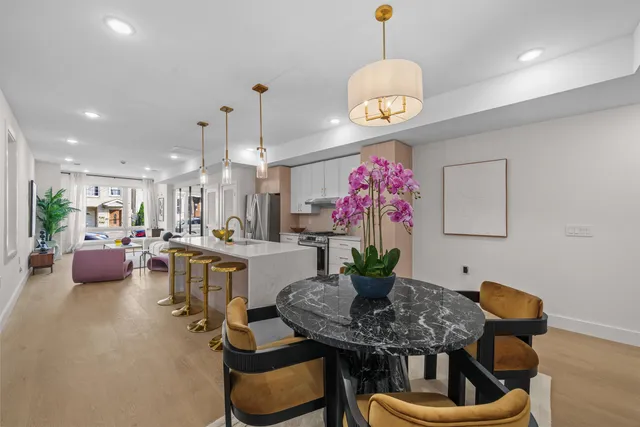 a kitchen with a table and chairs in it