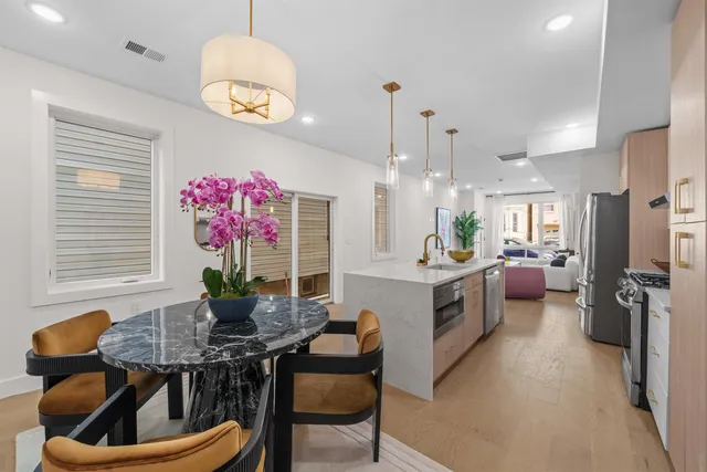 a kitchen with a table and chairs in it