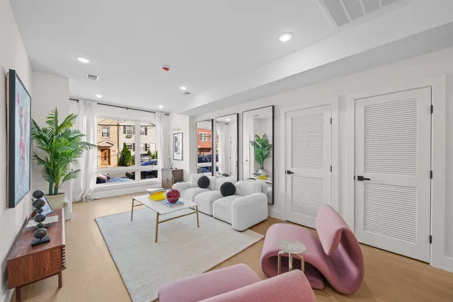 a living room with furniture or couch and a large window