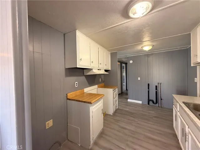 a view of a kitchen with electric appliances
