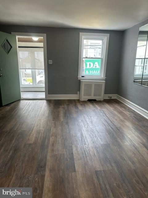 7143 Radbourne Road Upper Darby, PA 19082 - Photo 3 of 19 an empty room with wooden floor and windows