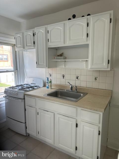 7143 Radbourne Road Upper Darby, PA 19082 - Photo 4 of 19 a kitchen with stainless steel appliances granite countertop a sink and dishwasher with white cabinets