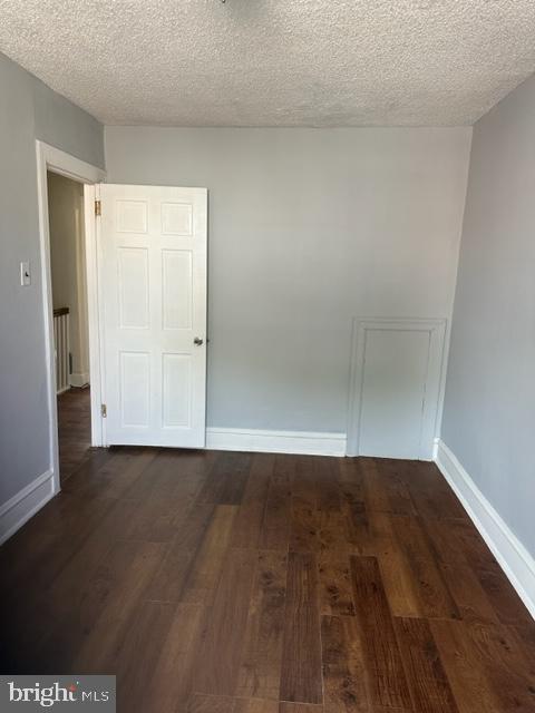 7143 Radbourne Road Upper Darby, PA 19082 - Photo 9 of 19 a view of an empty room with wooden floor and closet