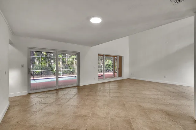 a large kitchen with stainless steel appliances a refrigerator and a sink