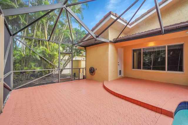 a view of a backyard with a swimming pool