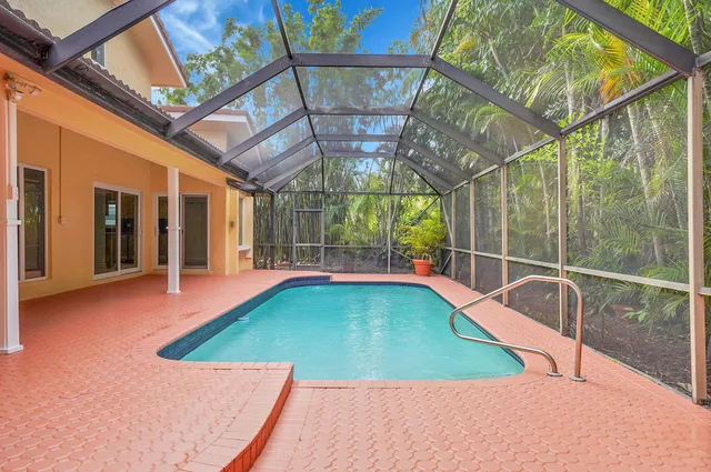 a bedroom with a large bed and a large window