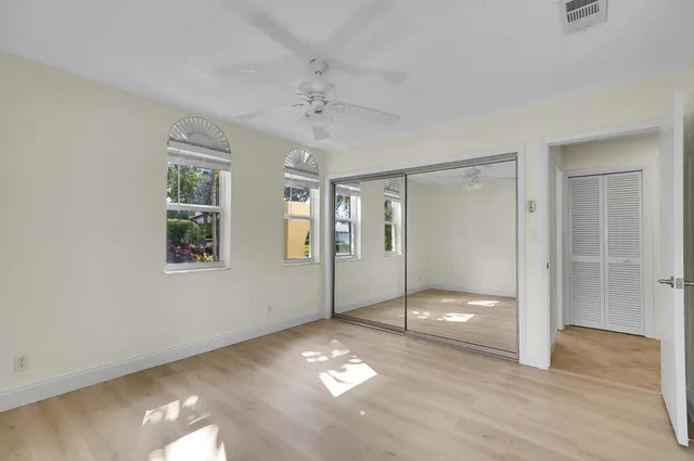 a bedroom with a bed and a walk in closet