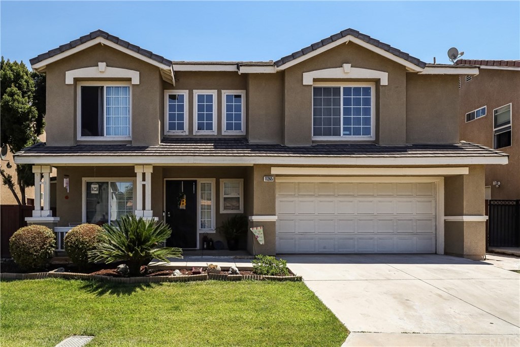 11265 Mathilda Lane Riverside, CA 92508 - Photo 1 of 1 a front view of a house with a yard