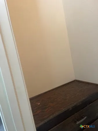 a view of small space with wooden floor
