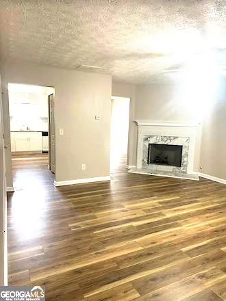 a view of livingroom and kitchen with wooden floor