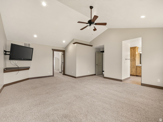 1279 West 1500th Street North Mapleton, UT 84664 - Photo 41 of 83 Spacious carpeted room featuring a vaulted ceiling with a ceiling fan, recessed lighting, and a wall-mounted display shelf