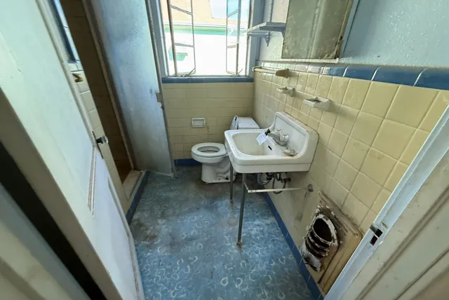 view of a bathroom with a sink and mirror