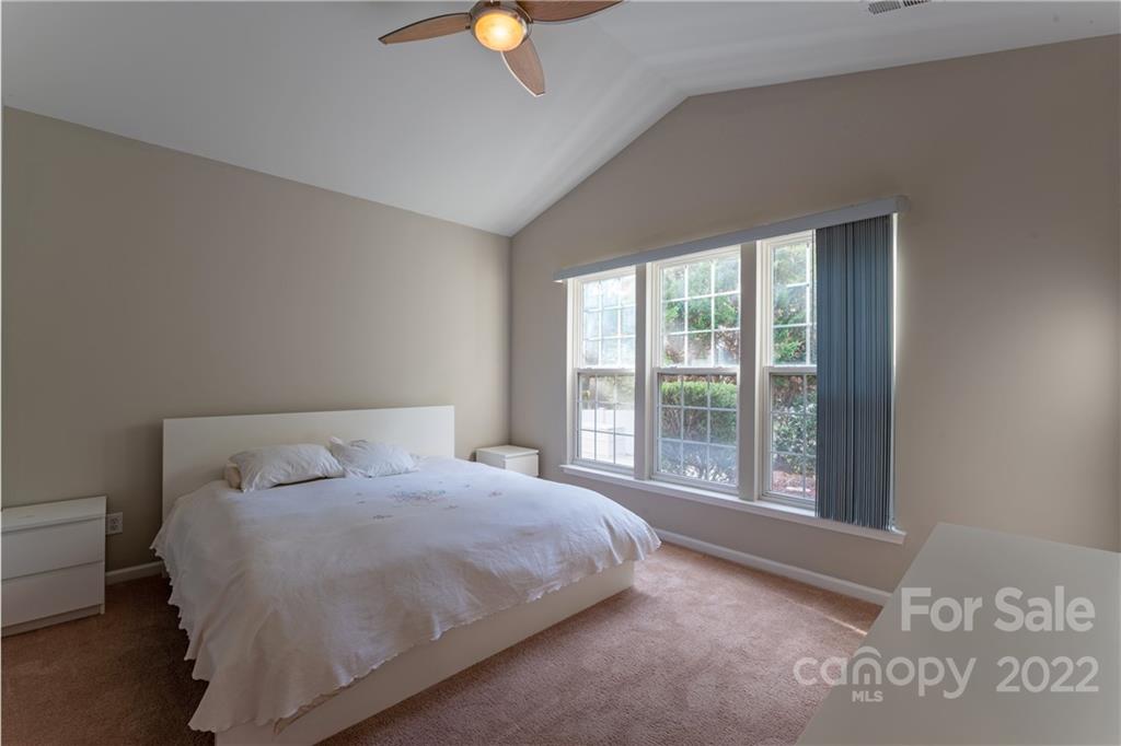 3106 Tanzanite Circle Fort Mill, SC 29708 - Photo 16 of 36 a bedroom with a bed and a window