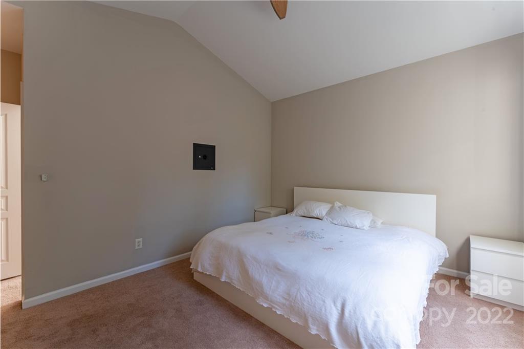 3106 Tanzanite Circle Fort Mill, SC 29708 - Photo 19 of 36 a bedroom with a bed and a night stand