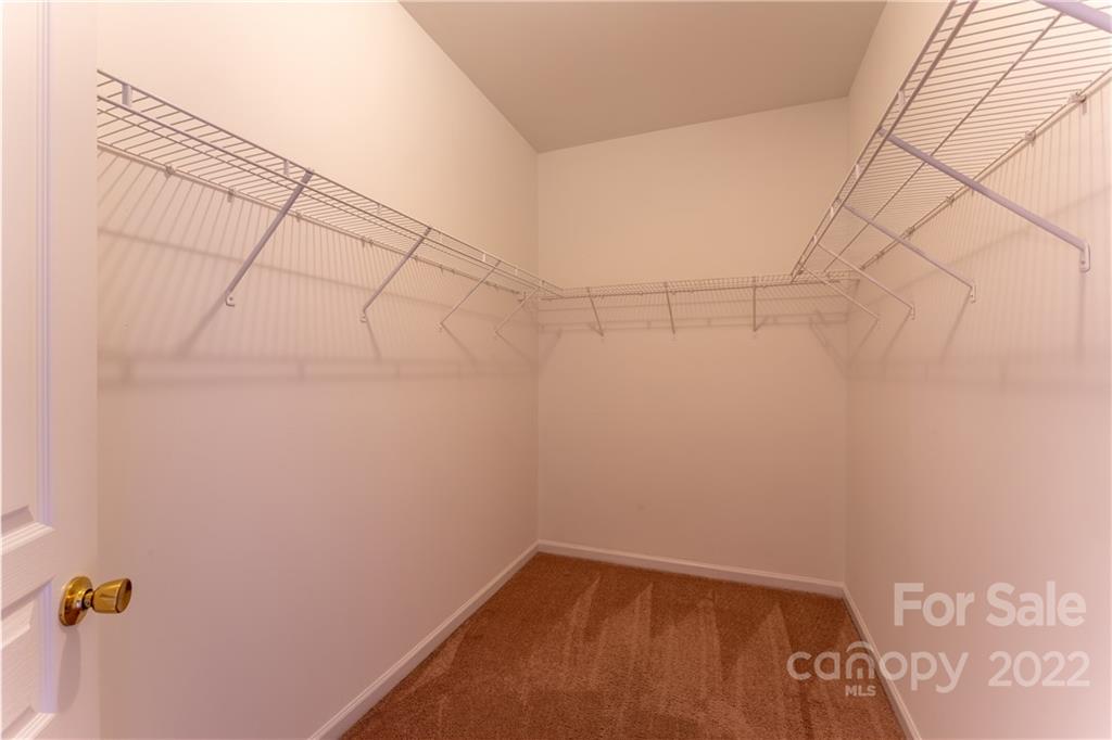 3106 Tanzanite Circle Fort Mill, SC 29708 - Photo 20 of 36 a view of a room with racks on the wall