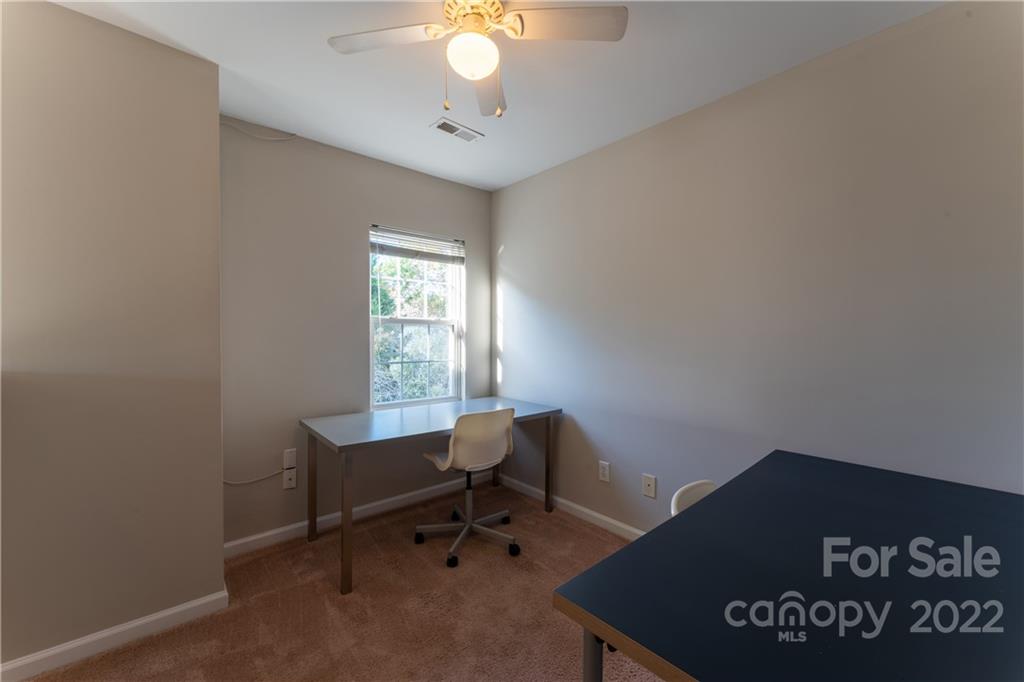 3106 Tanzanite Circle Fort Mill, SC 29708 - Photo 24 of 36 a view of a workspace with furniture and a window