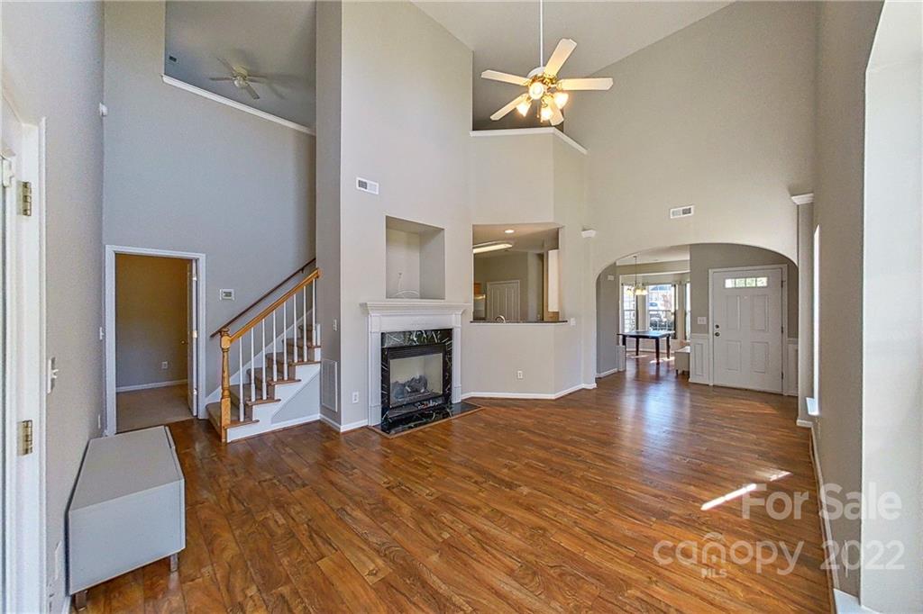 3106 Tanzanite Circle Fort Mill, SC 29708 - Photo 6 of 36 a view of empty room with fireplace and wooden floor