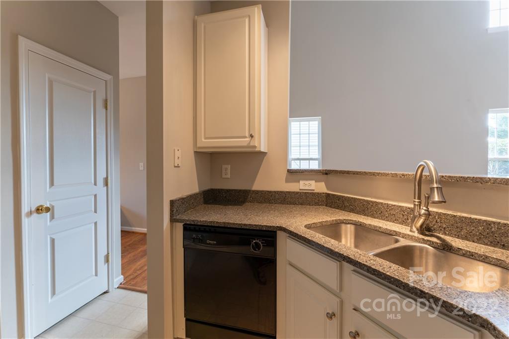 3106 Tanzanite Circle Fort Mill, SC 29708 - Photo 10 of 36 a kitchen with granite countertop a sink and a stove