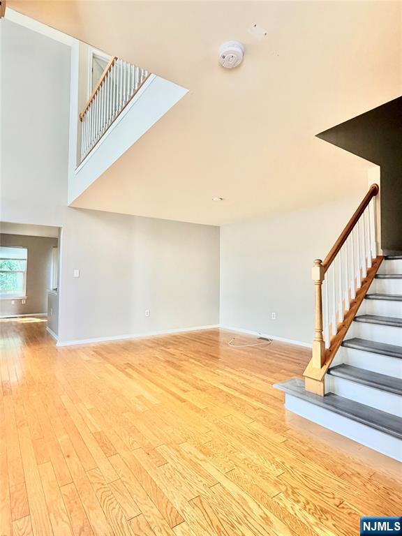 35 Harrier Court, Unit 35 Wayne, NJ 07470 - Photo 3 of 16 a view of an empty room with stairs and wooden floor