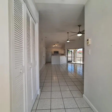 a view of a hallway with a white walls