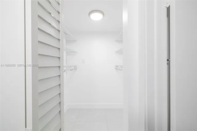 a view of a room with shelf on the wall