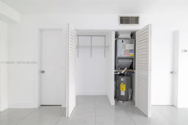 a view of storage utility and utility room