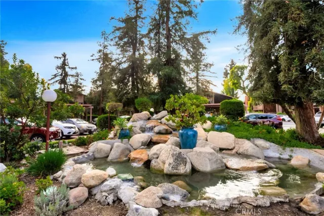 a garden with lots of flowers and trees