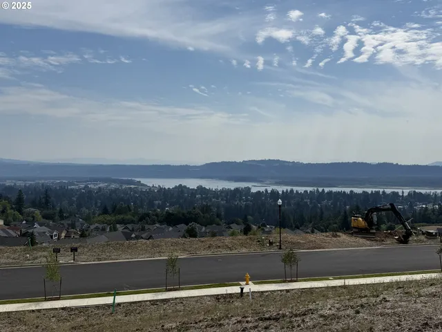 a view of a street with an ocean view