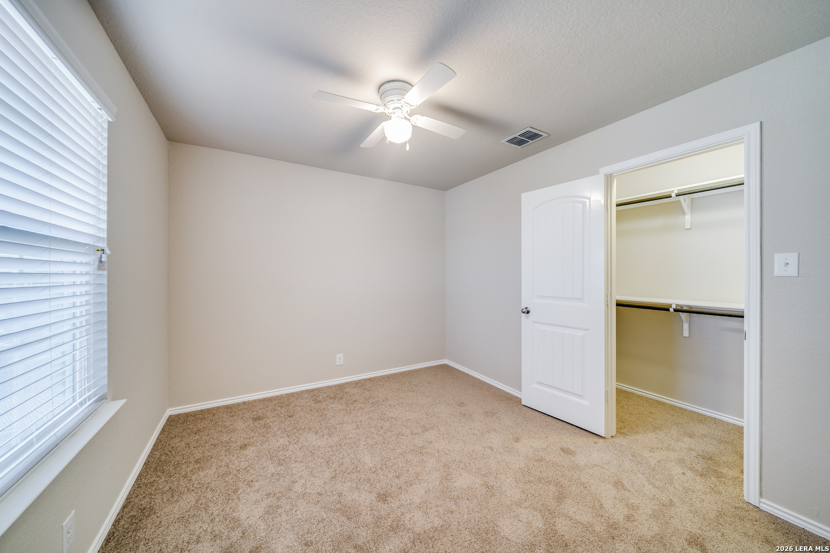 12358 Erstein Schertz, TX 78154 - Photo 12 of 21 an empty room with closet and a ceiling fan