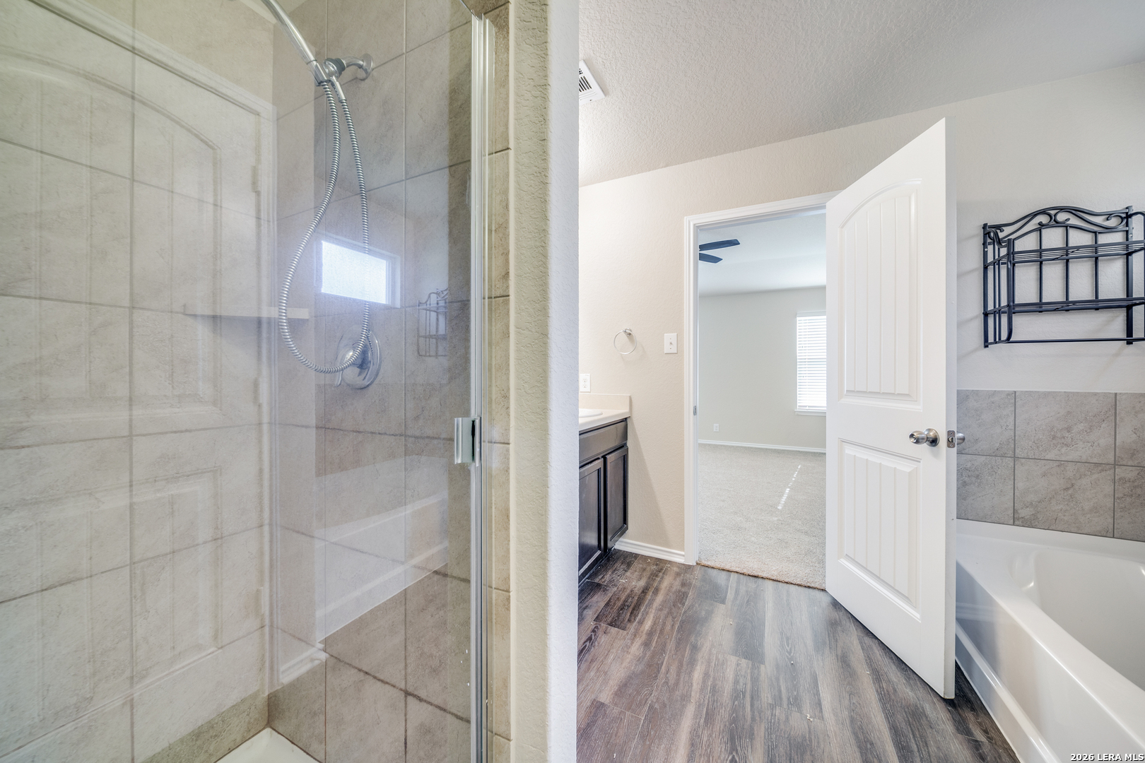 12358 Erstein Schertz, TX 78154 - Photo 13 of 21 a bathroom with a bathtub and shower