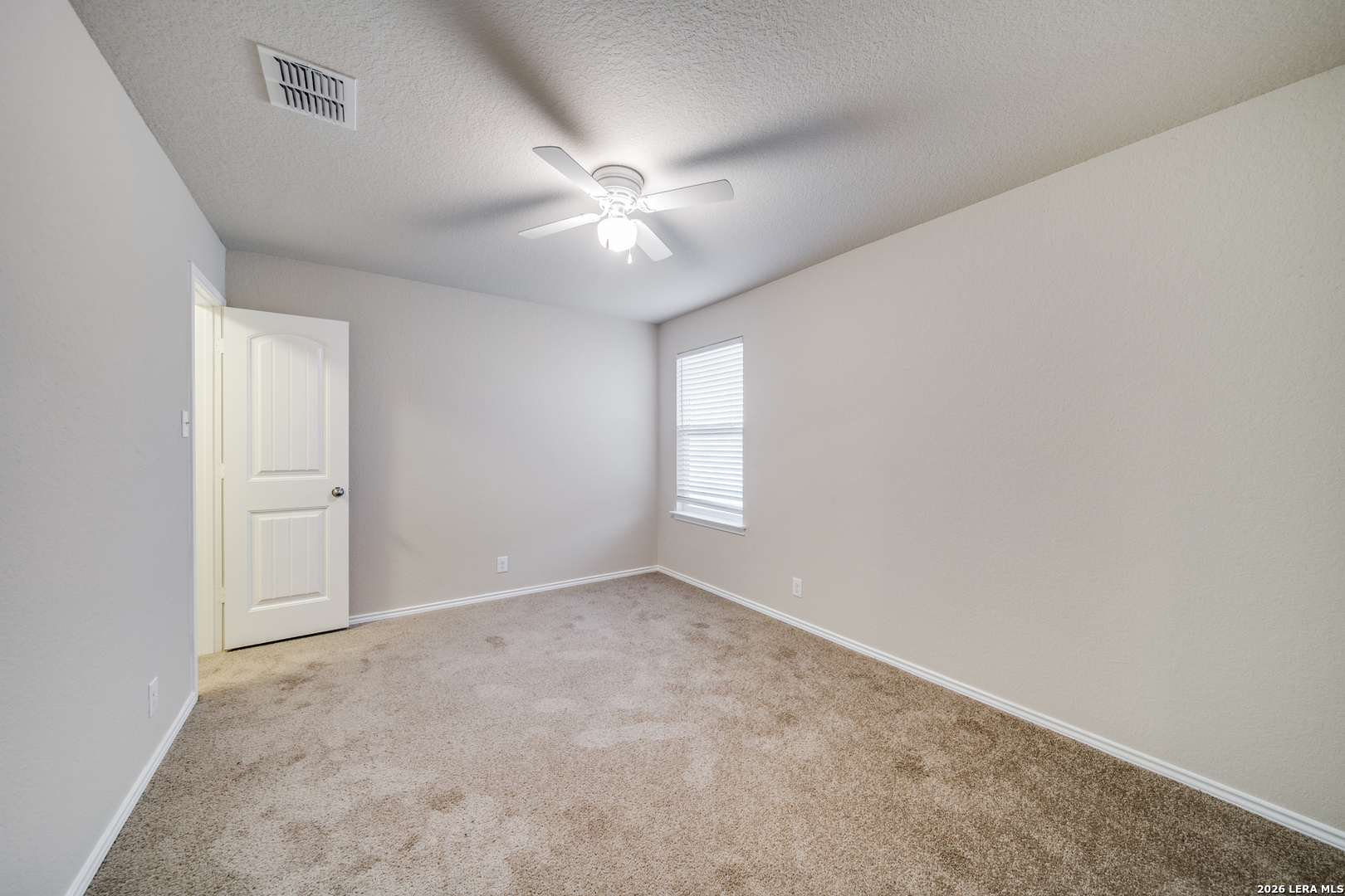 12358 Erstein Schertz, TX 78154 - Photo 17 of 21 an empty room with windows and fan