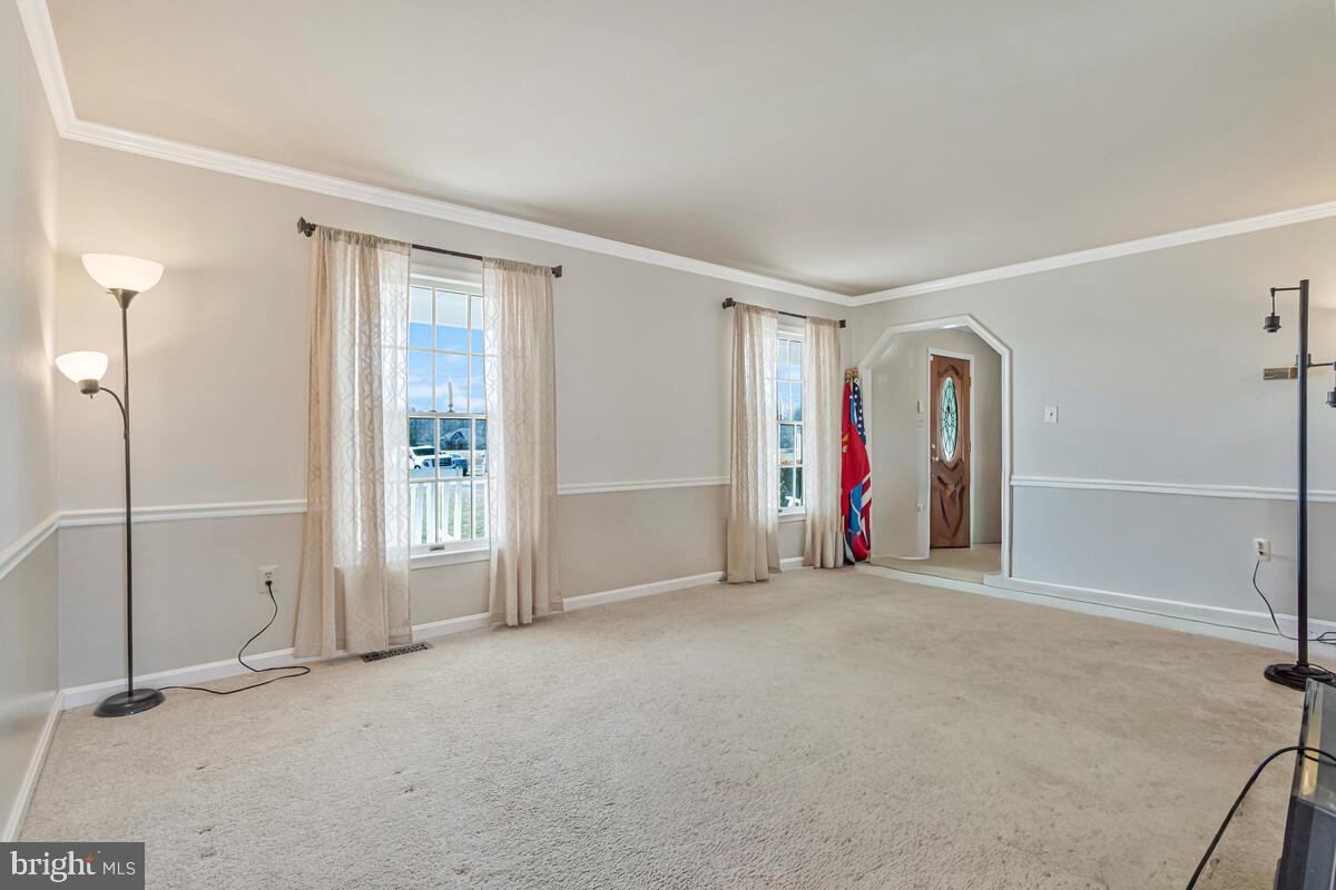 12630 Grosstown Road Hughesville, MD 20637 - Photo 11 of 44 an empty room with floor to ceiling window and closet