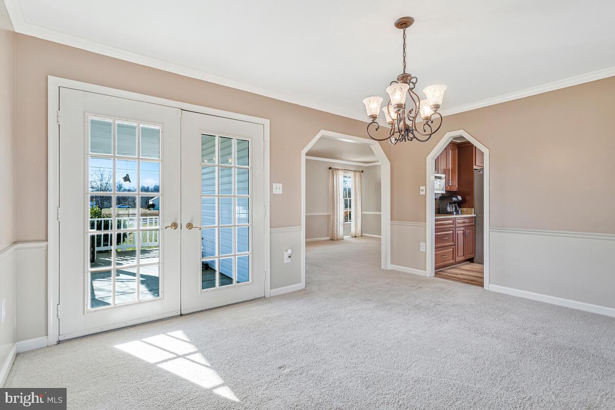 12630 Grosstown Road Hughesville, MD 20637 - Photo 20 of 44 a view of a big room with windows chandelier