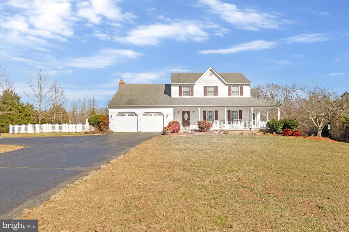 12630 Grosstown Road Hughesville, MD 20637 - Photo 2 of 44 a front view of a house with a yard