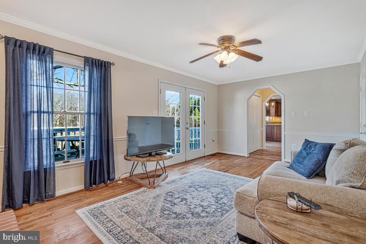 12630 Grosstown Road Hughesville, MD 20637 - Photo 22 of 44 a living room with furniture and a window