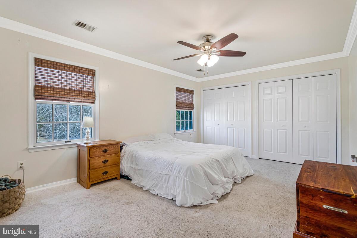 12630 Grosstown Road Hughesville, MD 20637 - Photo 23 of 44 a bedroom with a bed and window
