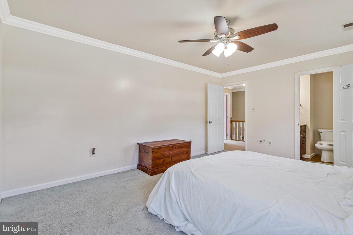 12630 Grosstown Road Hughesville, MD 20637 - Photo 25 of 44 a bedroom with a bed and window