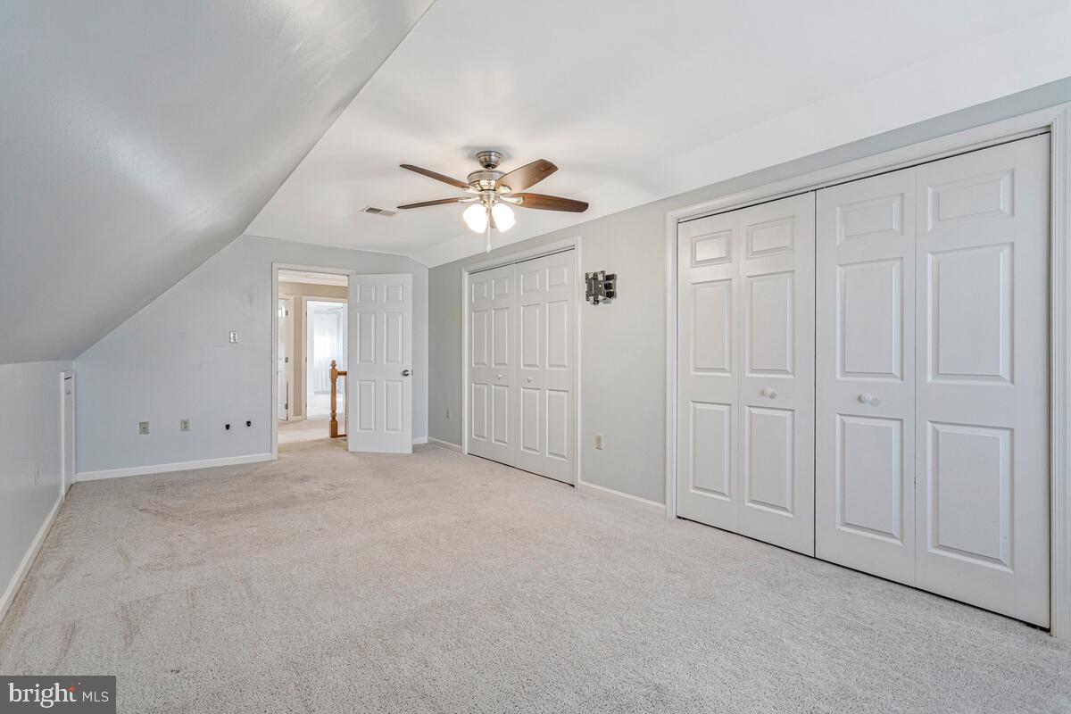12630 Grosstown Road Hughesville, MD 20637 - Photo 28 of 44 an empty room with chandelier fan
