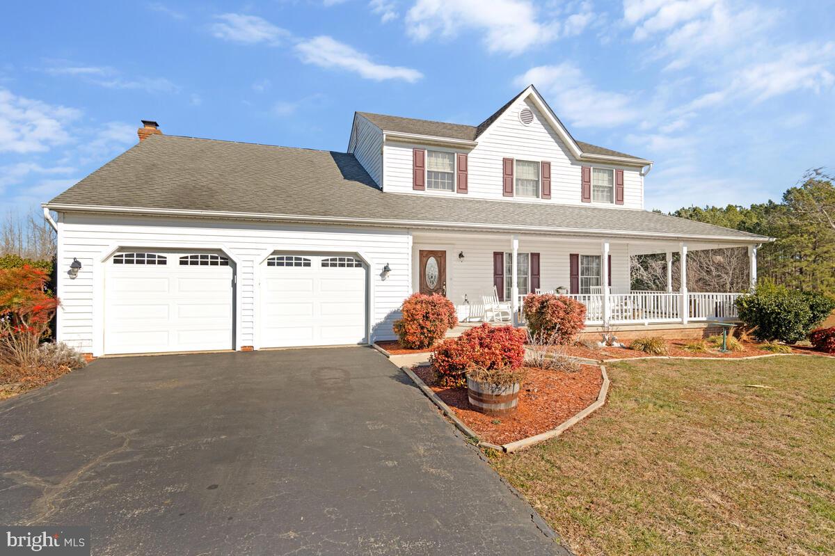 12630 Grosstown Road Hughesville, MD 20637 - Photo 3 of 44 front view of a house with a yard