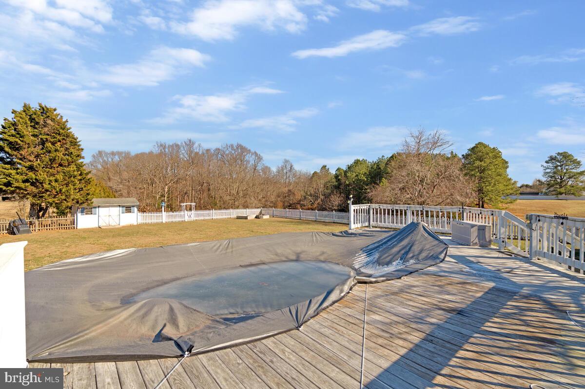 12630 Grosstown Road Hughesville, MD 20637 - Photo 40 of 44 a view of a swimming pool with a lounge chair