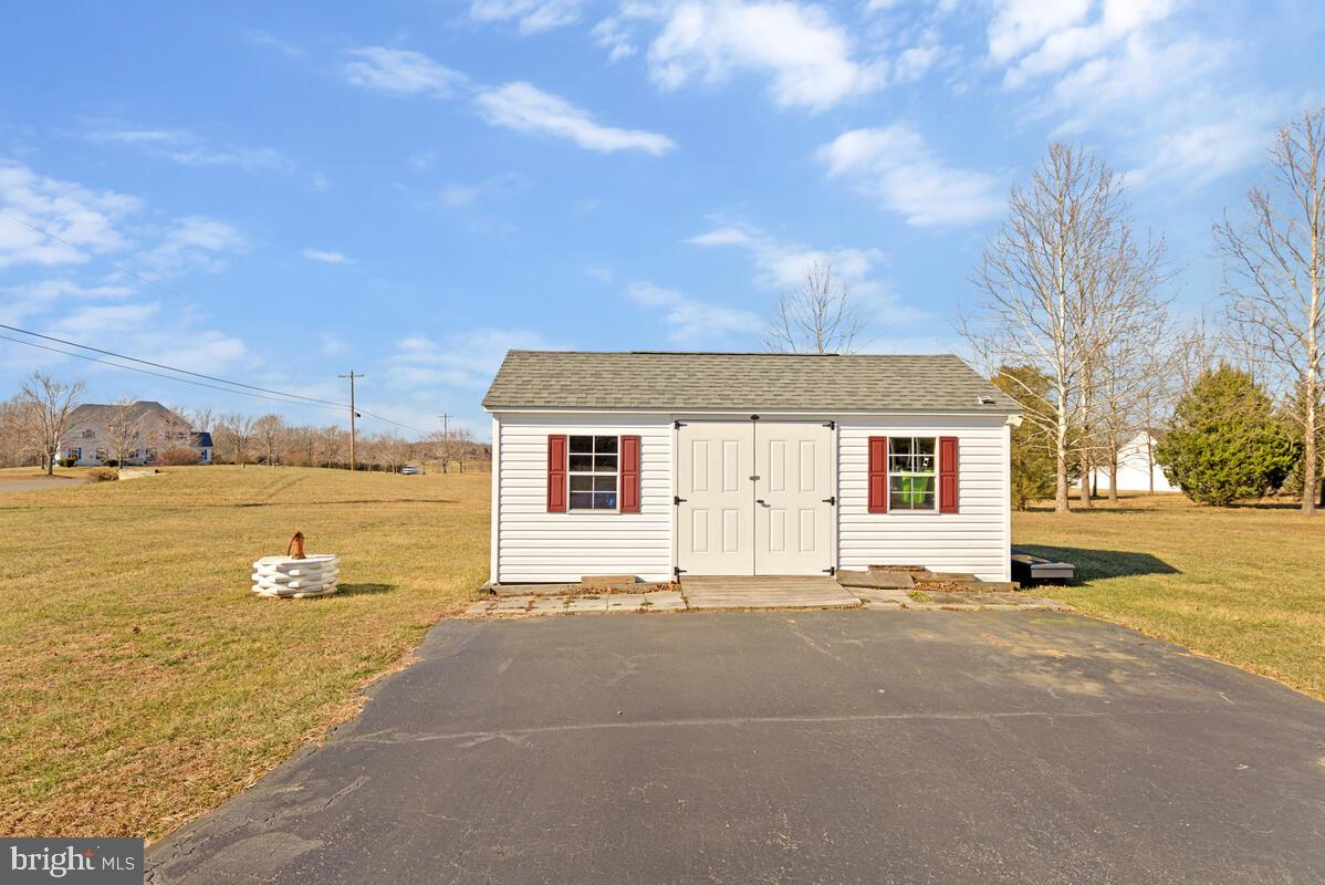 12630 Grosstown Road Hughesville, MD 20637 - Photo 41 of 44 a front view of a house with a big yard