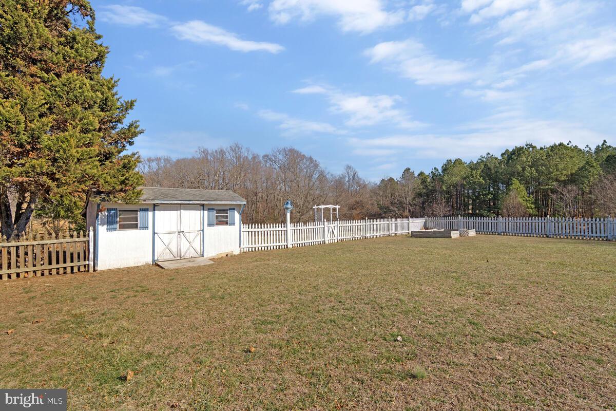 12630 Grosstown Road Hughesville, MD 20637 - Photo 42 of 44 a view of pool and trees in the background
