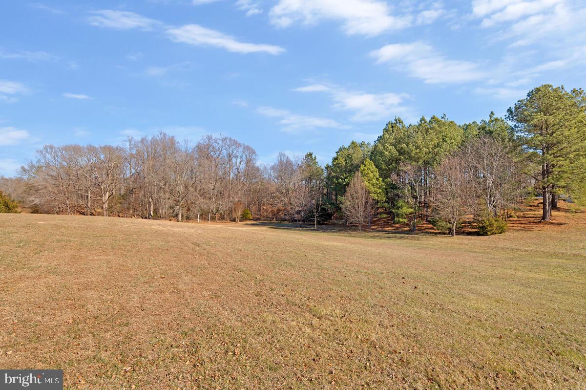 12630 Grosstown Road Hughesville, MD 20637 - Photo 43 of 44 a view of a field with trees in the background