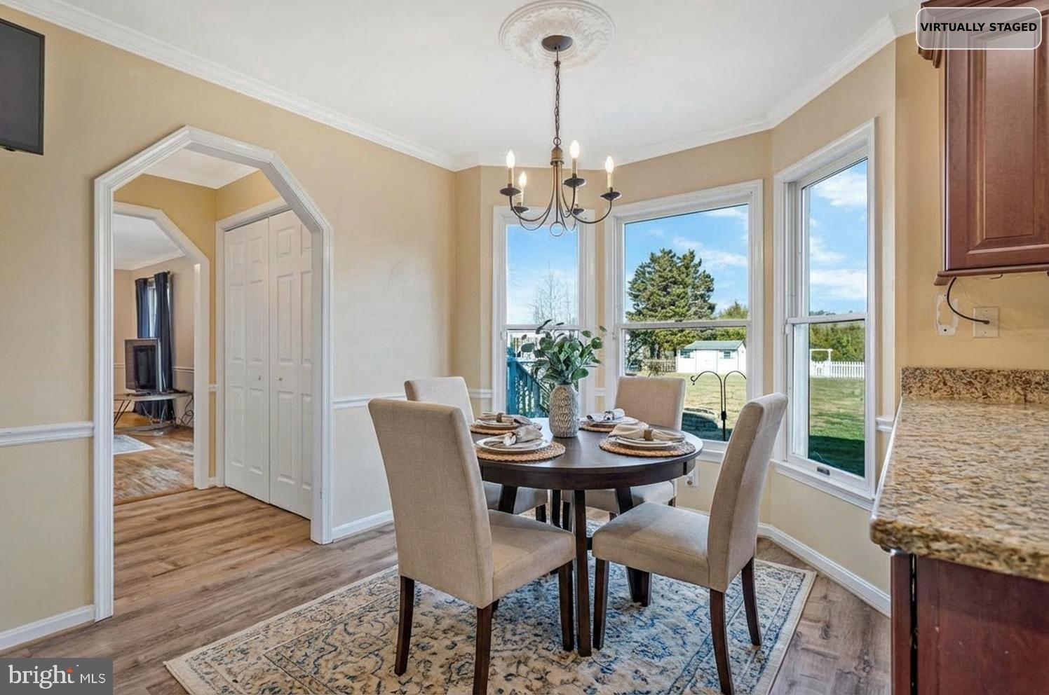 12630 Grosstown Road Hughesville, MD 20637 - Photo 5 of 44 a view of a dining room with furniture window and wooden floor