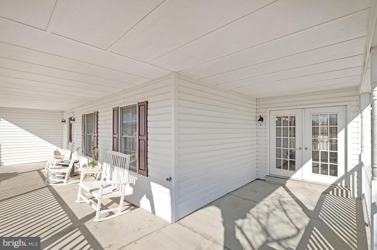 12630 Grosstown Road Hughesville, MD 20637 - Photo 7 of 44 a view of a patio with wooden floor