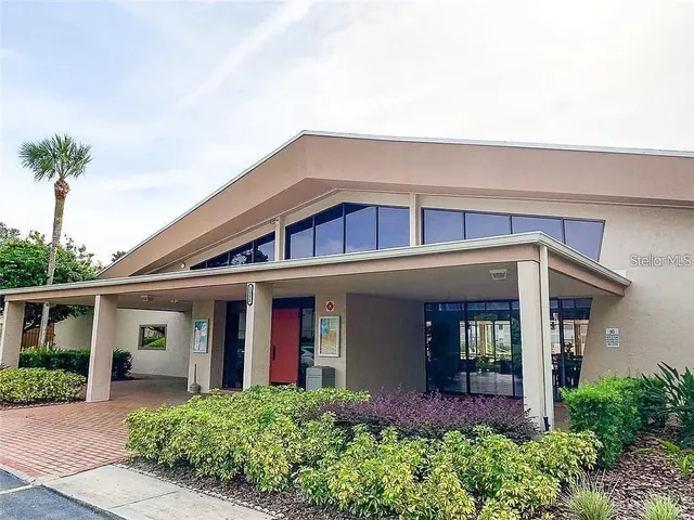 front view of a house with potted plants
