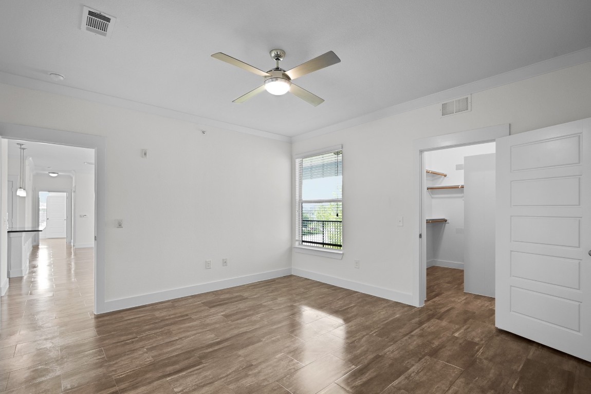 366 Fm 1488 Road, Unit 937 Conroe, TX 77384 - Photo 15 of 24 wooden floor in an empty room with a window