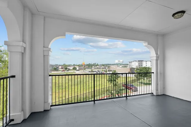 a view of a balcony with city view